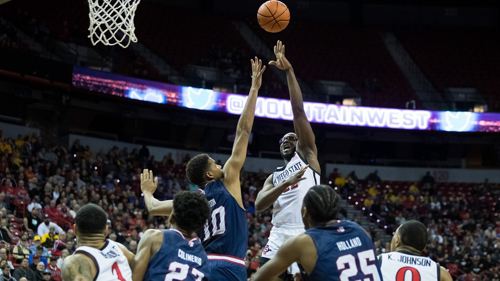 Tahirou Diabate shoots over Fresno State defenders in Aztecs 53-46 win to advance to the Mountain West semifinals.